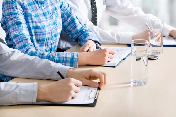 Business people writing notes — Stock Photo, Image