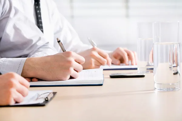 Business people writing notes — Stock Photo, Image