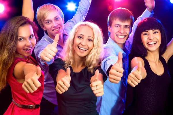 Happy people in Santa hats — Stock Photo, Image