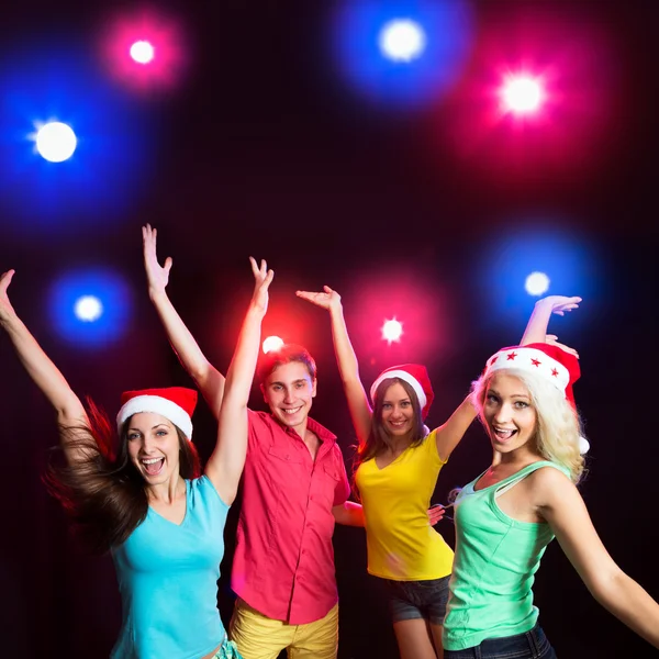 Happy people in Santa hats — Stock Photo, Image