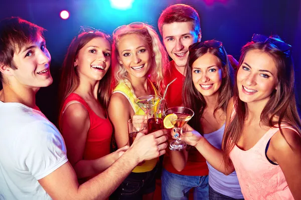 Friends clinking by glasses Stock Image