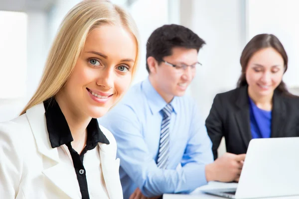 Business woman and her collegues — Stock Photo, Image