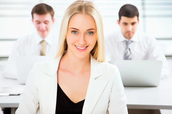 Beautiful businesswoman in an office — Stock Photo, Image