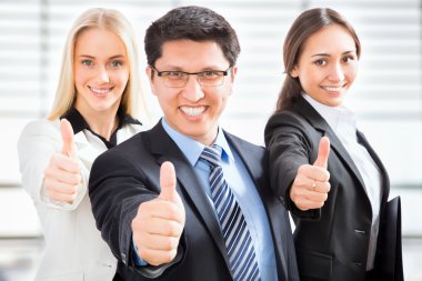 Business team showing thumbs up clipart