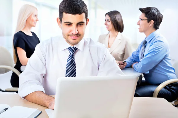 Happy businessman with colleagues — Stock Photo, Image