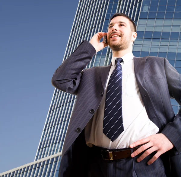 Businessman speaks by phone — Stock Photo, Image