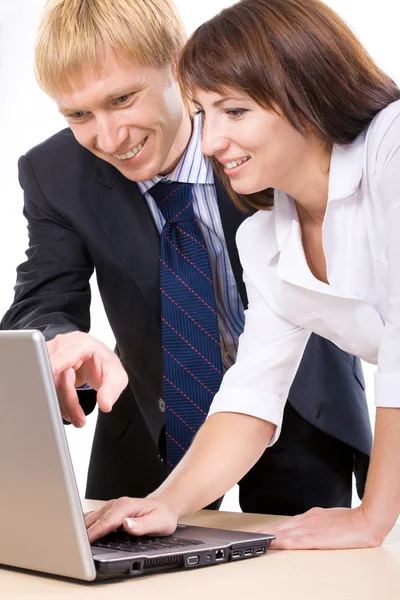 Man and woman looking at monitor Stock Image