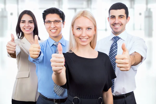 Business people showing thumbs up sign — Stock Photo, Image