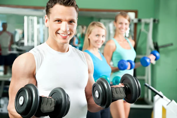 Man with weight training equipment — Stock Photo, Image