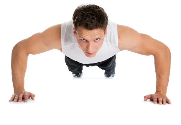 Fitness muscle model guy making push ups exercise — Stock Photo, Image