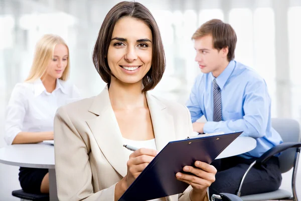 Business woman with her staff — Stock Photo, Image