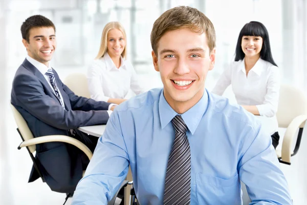 Happy business man with colleagues — Stock Photo, Image
