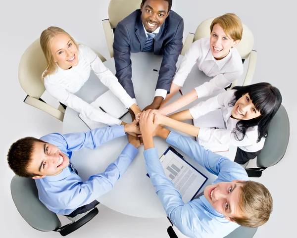 Business team making pile of hands — Stock Photo, Image