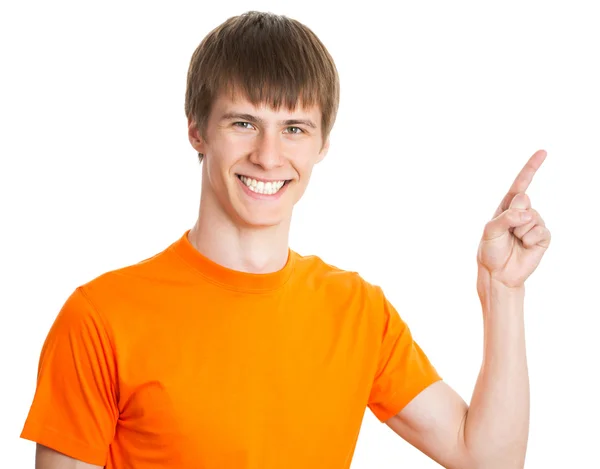 Young man pointing on white background — Stock Photo, Image