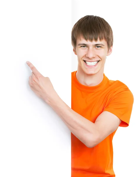 Young man pointing on white background — Stock Photo, Image