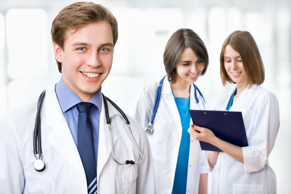 Doctor with colleagues — Stock Photo, Image