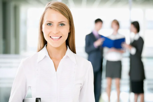 Businesswoman with colleagues — Stock Photo, Image