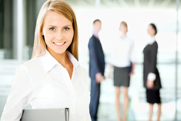 Businesswoman with colleagues — Stock Photo, Image