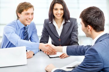 Business people shaking hands clipart