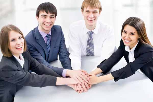 Equipo de negocios gesticulando unidad — Foto de Stock