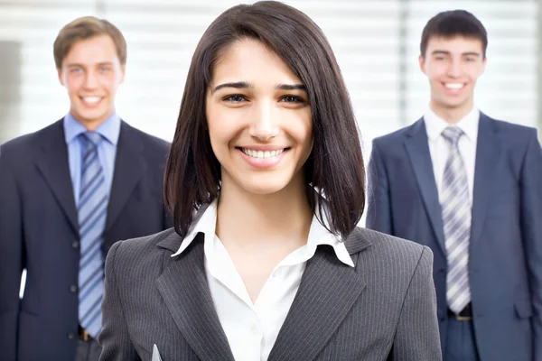 Business team A business team with pretty business woman — Stock Photo, Image