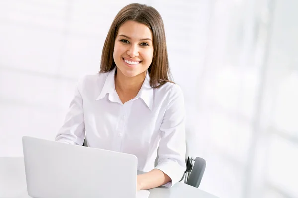 Business woman working at laptop Stock Photo