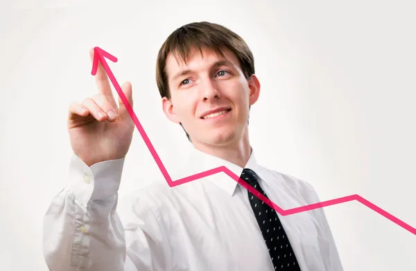 Businessman pointing on graph — Stock Photo, Image