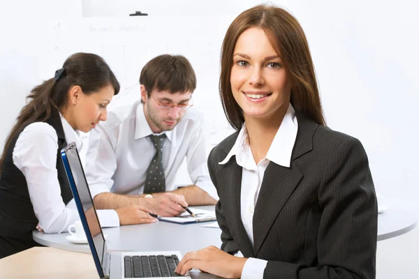 Businesswoman and colleagues — Stock Photo, Image