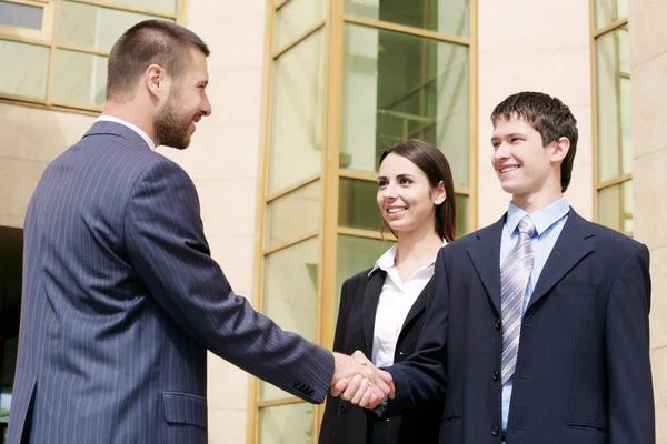 Businesspeople shake hands — Stock Photo, Image