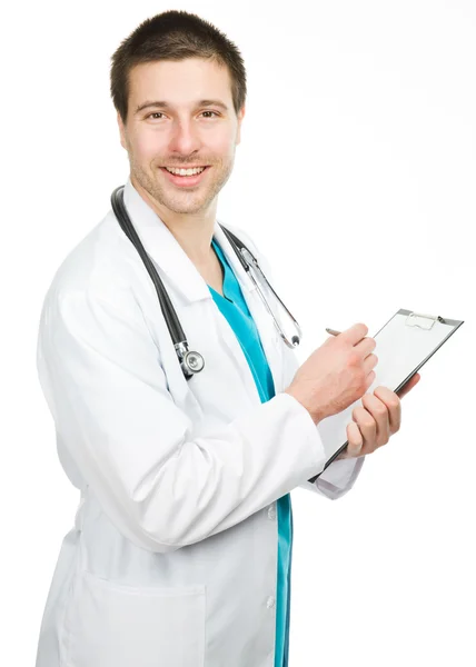 Doctor with stethoscope writing Stock Image