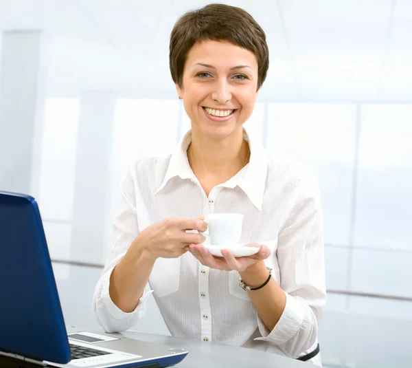 Businesswoman with cup — Stock Photo, Image