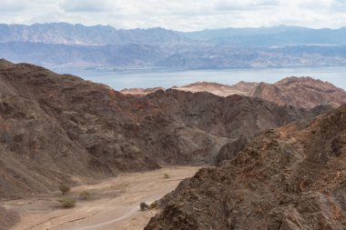 Rural gravel goad between hills, Eilat Aqaba gulf at Red sea