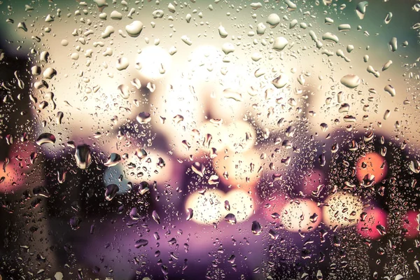 Gocce di pioggia su vetro Immagine Stock