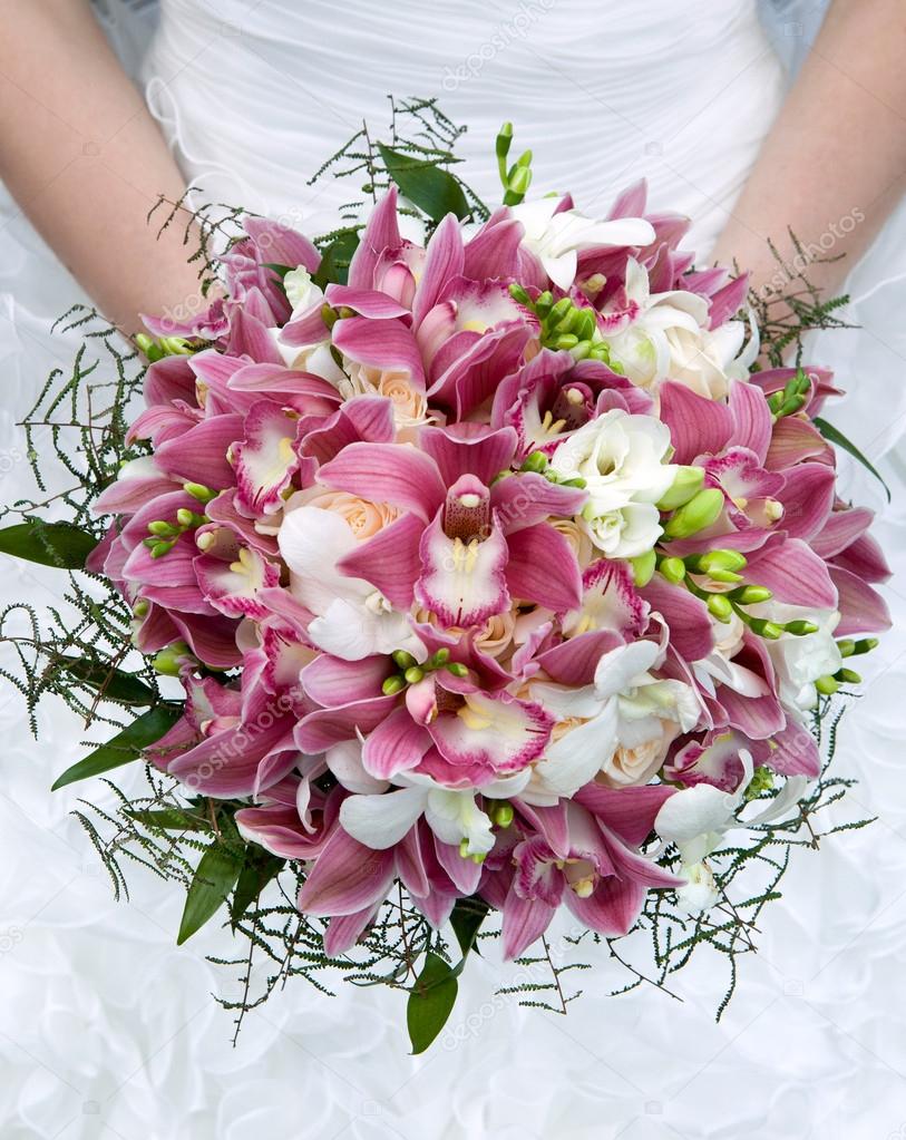 Bouquet of fresh flowers for the wedding ceremony. Bouquet of orchids