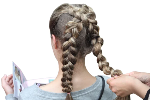 Hairdresser making a braid for a girl. Children's hairstyle. Braids. — Stock Photo, Image