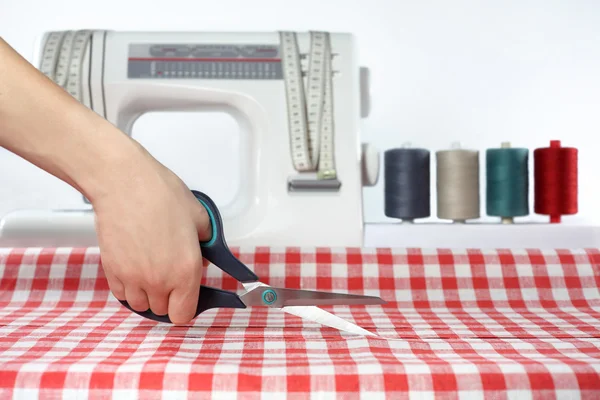 Tailor. Sewing. Cutting fabric. Dressmaker at work. Fabric cutting scissors. — Stock Photo, Image