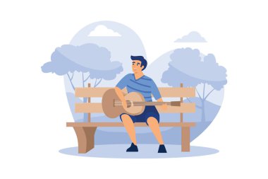 Genç adam bankta oturuyor ve parkta akustik gitar çalıyor..