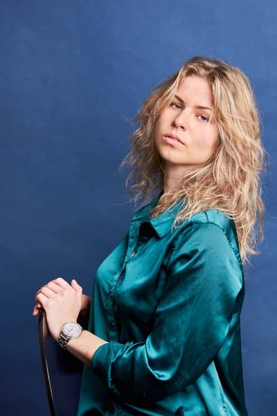 Young beautiful woman in blue collar shirt