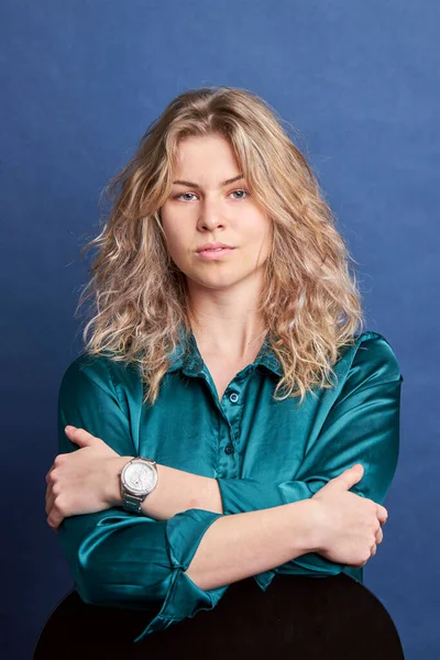 Young beautiful woman in blue collar shirt