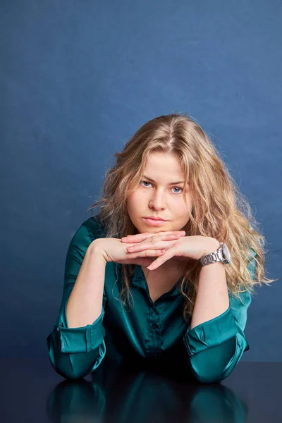 Young beautiful woman in blue collar shirt