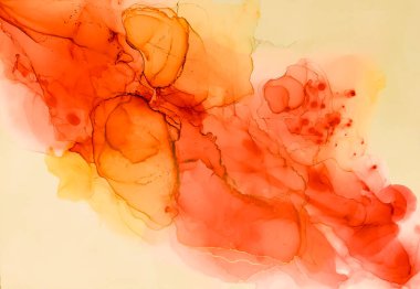 Alkol mürekkebinin arka plan dokusu kırmızı ve sarı renklerde. Damlaları ve lekeleri olan soyut boya.