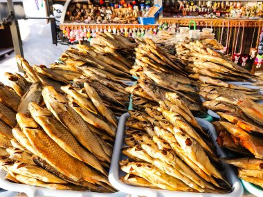 a lot of dried small fish is on the counter