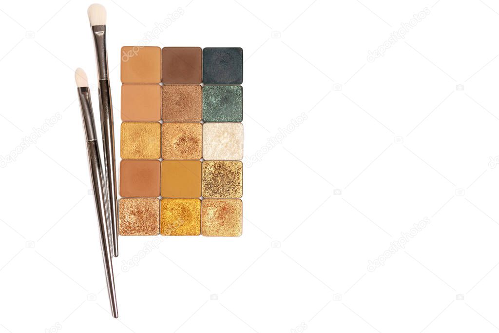 Set of single eye shadows with cosmetic brushes isolated on a white background. Space for text