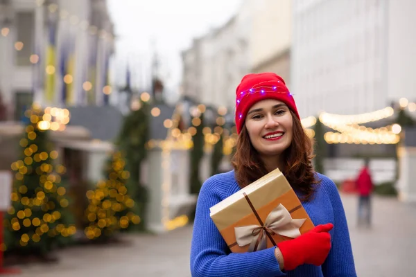 Charming Young Woman Receiving Gift Box Christmas Fair Space Text — Stock Photo, Image