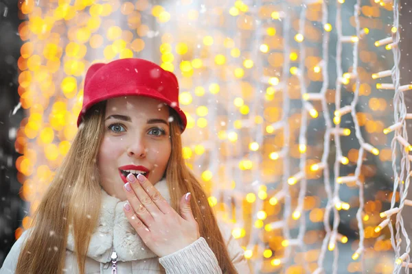 Excited Blond Woman Covering Her Lips Hands Posing Garlands Lights — Stock Photo, Image