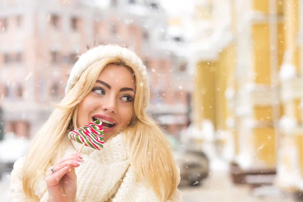 Glamor Blond Woman Eating Colorful Candies Street Snowflakes Empty Space — Stock Photo, Image