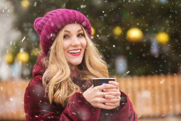 Pretty Blond Woman Wears Red Knitted Cap Drinking Coffee Winter — Stock Photo, Image