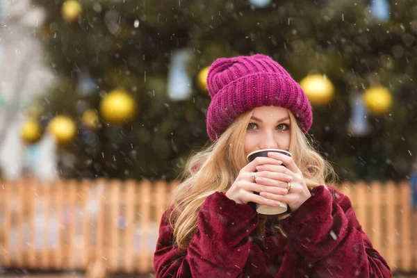 Charming Blond Woman Wears Red Knitted Cap Drinking Coffee Winter — Stock Photo, Image