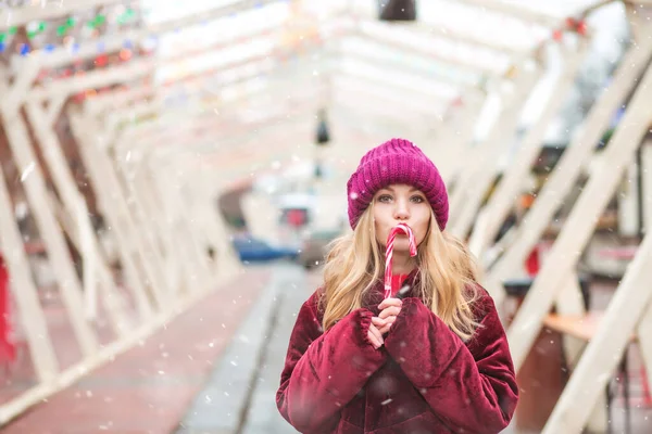 Lovely Blond Woman Wears Knitted Hat Eating Sweet Candy Cane — Stock Photo, Image