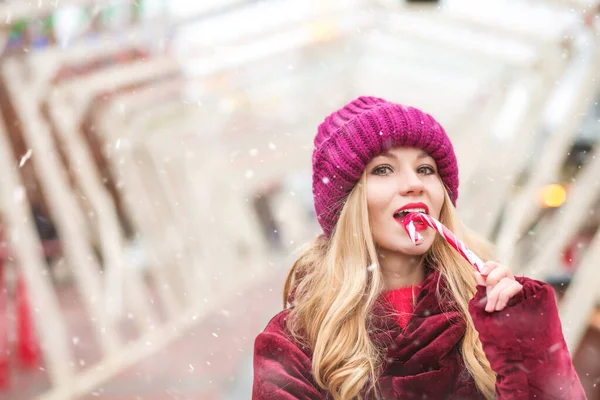 Attractive Blond Woman Wears Knitted Hat Eating Sweet Candy Cane — Stock Photo, Image